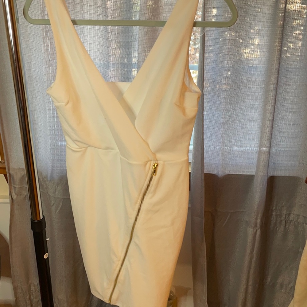 White dress with gold zipper accent